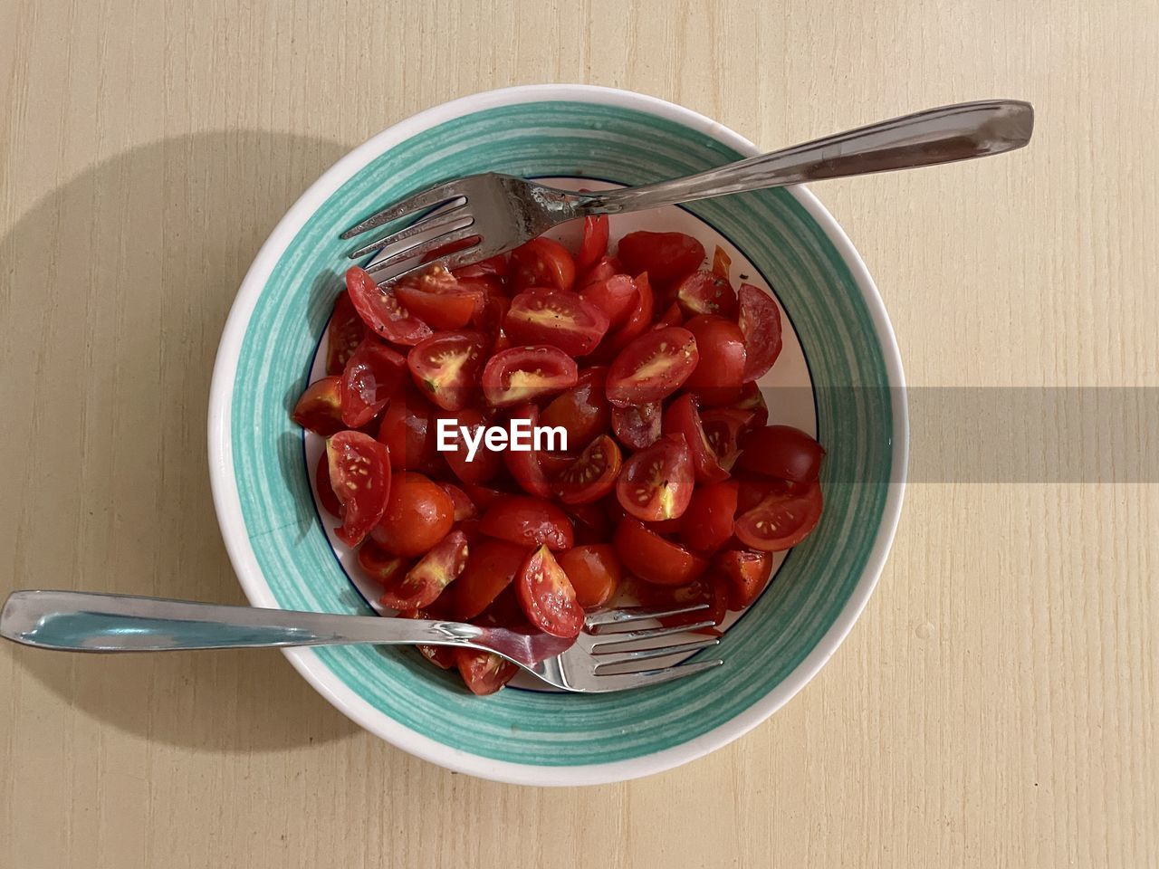 Plate of tomato salad with two forks