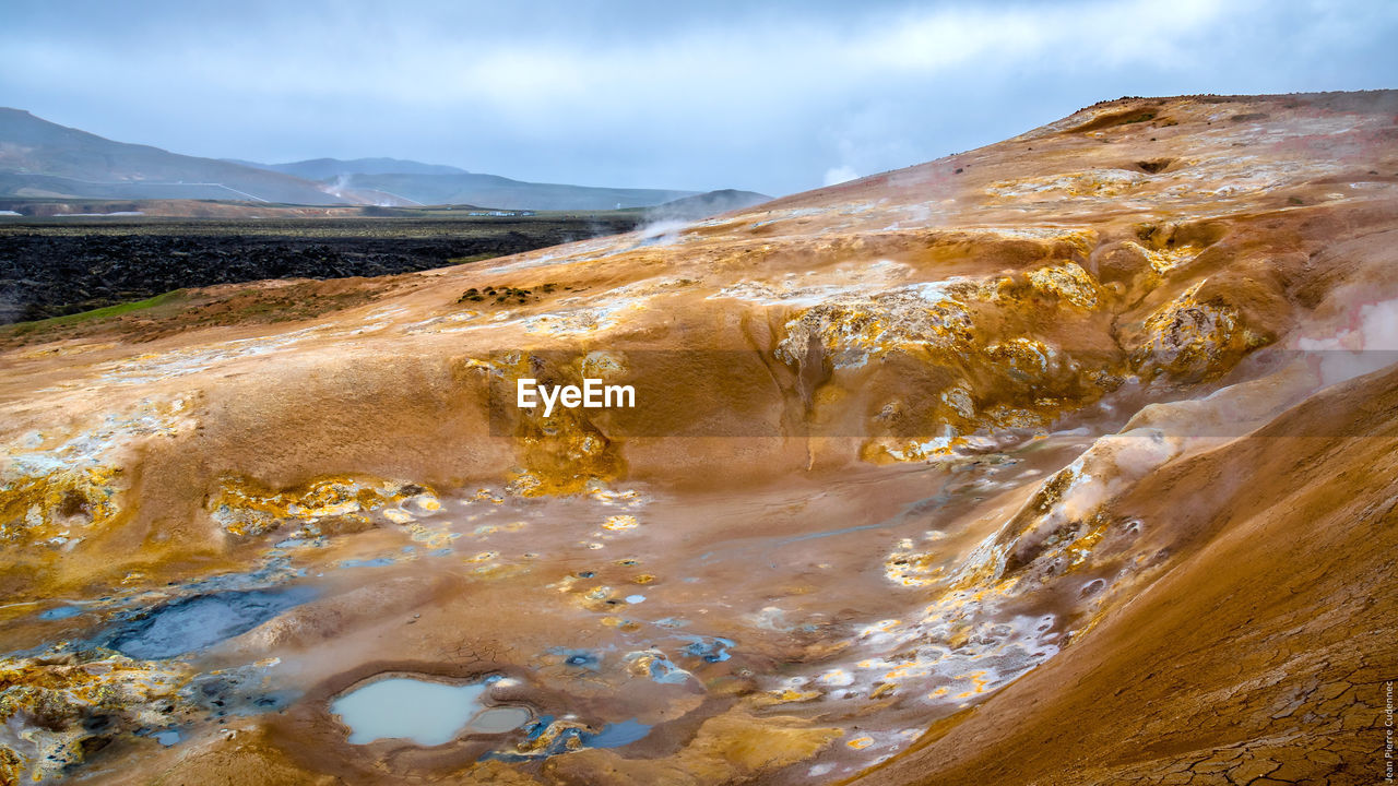 Geyser at leirhnjukur against sky