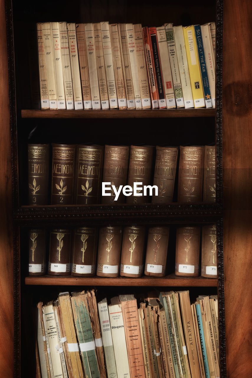 STACK OF BOOKS ON SHELF