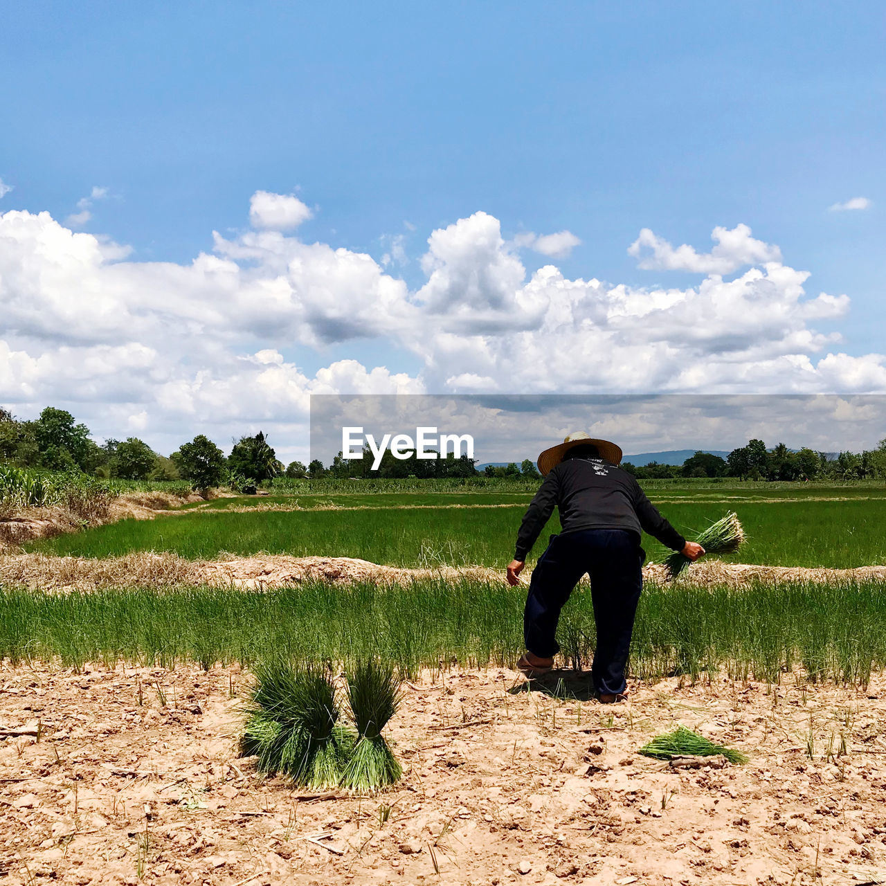 Full length of woman on field against sky