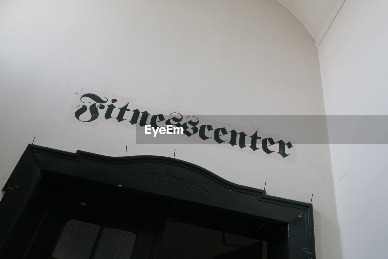 LOW ANGLE VIEW OF TEXT ON WALL