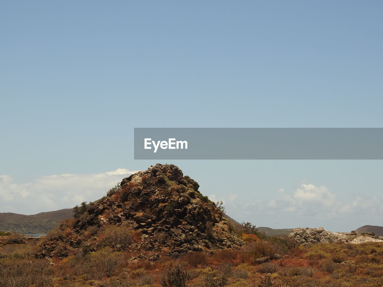 SCENIC VIEW OF ROCK AGAINST SKY