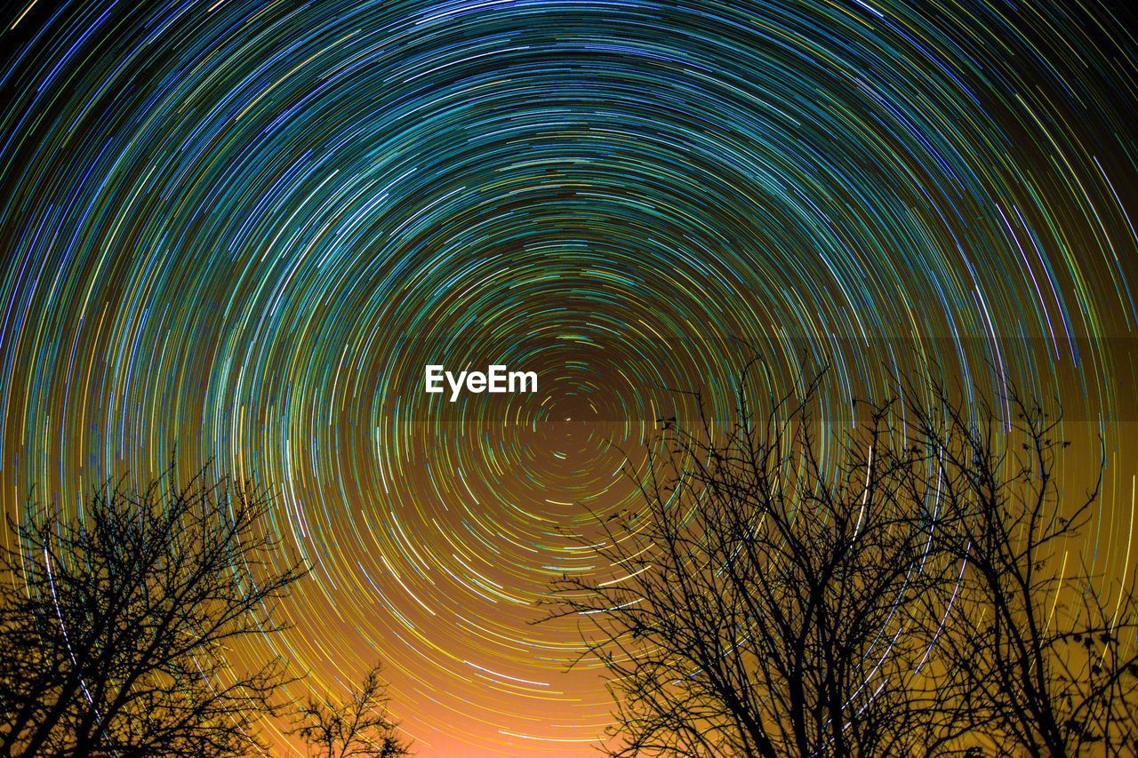 Low angle view of star trails