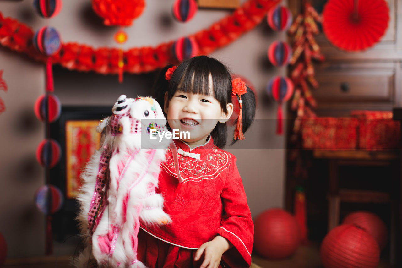 Cute girl standing in traditional clothing