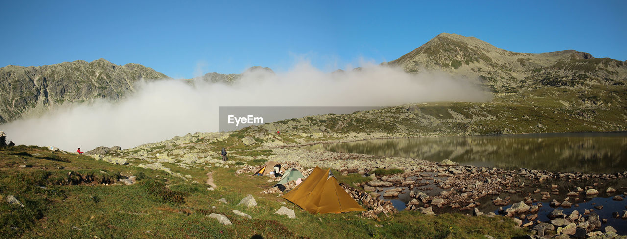 Tents on mountain against sky