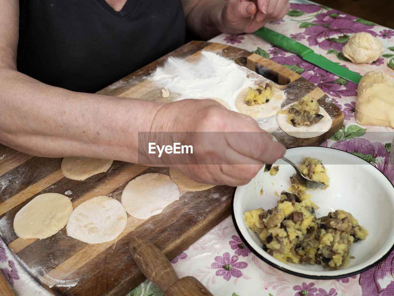 HIGH ANGLE VIEW OF MAN PREPARING FOOD