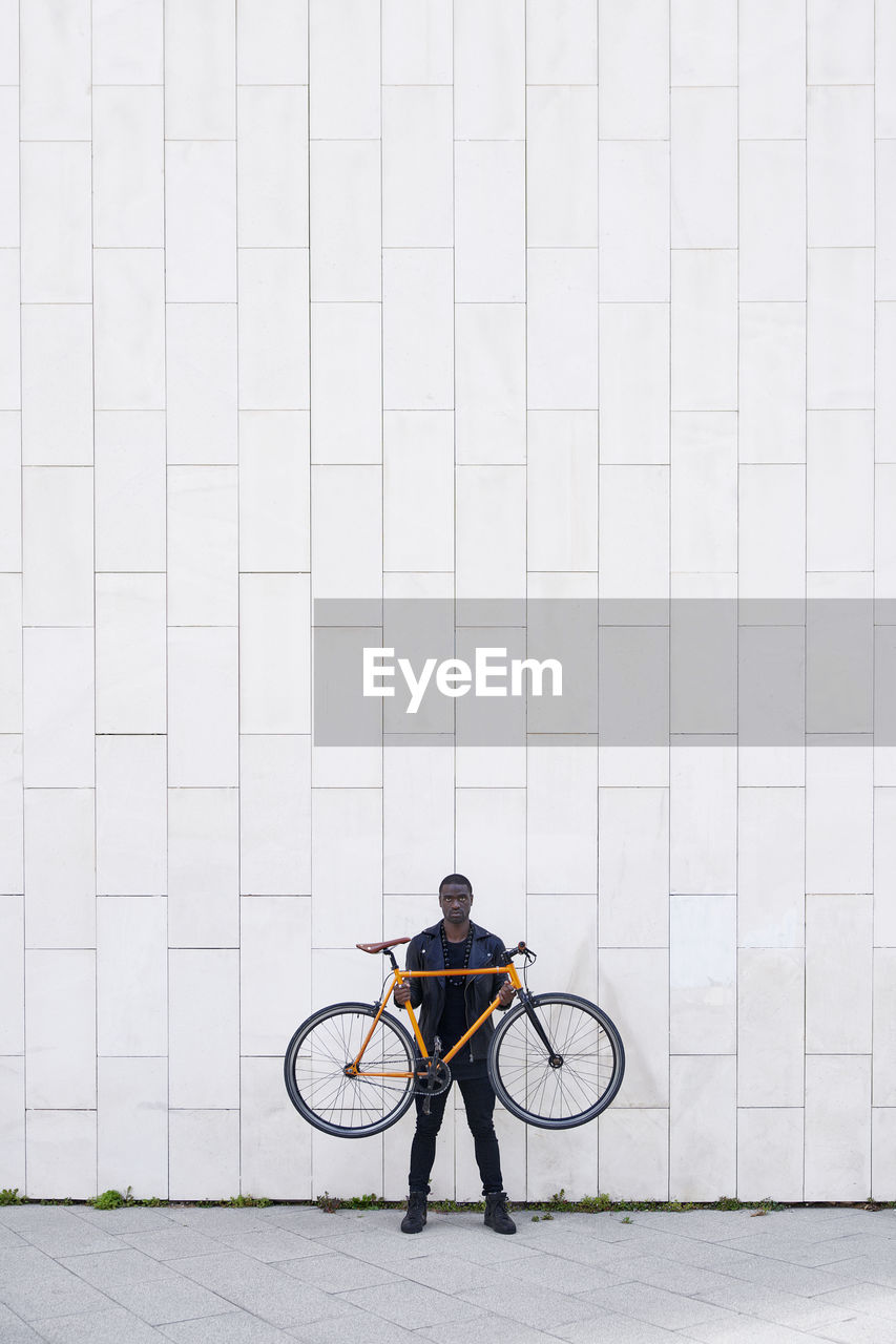 Man holding his bike