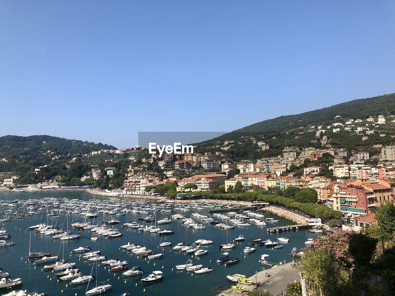 Aerial view of townscape by sea against clear blue sky, lerici