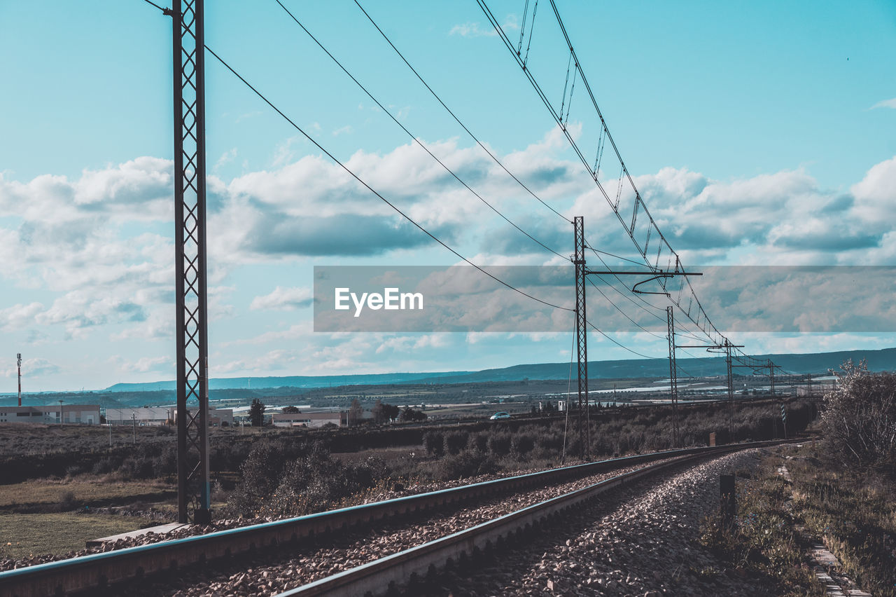 Railroad tracks against clear sky