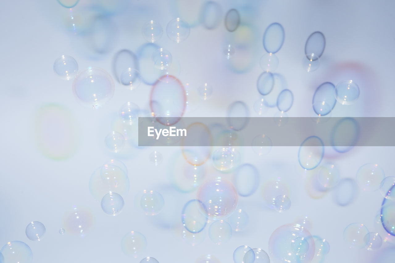 Close-up of bubbles against white background