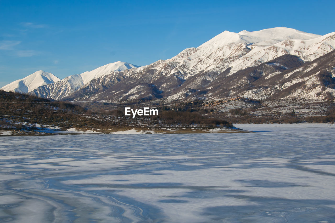 Typical winter landscape in abruzzo mountains with frozen lake