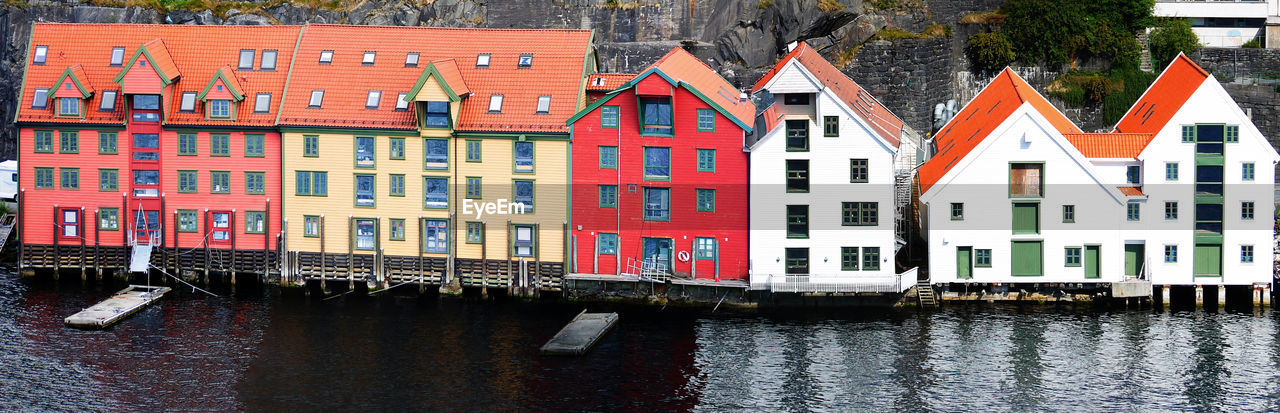 Buildings by canal in city