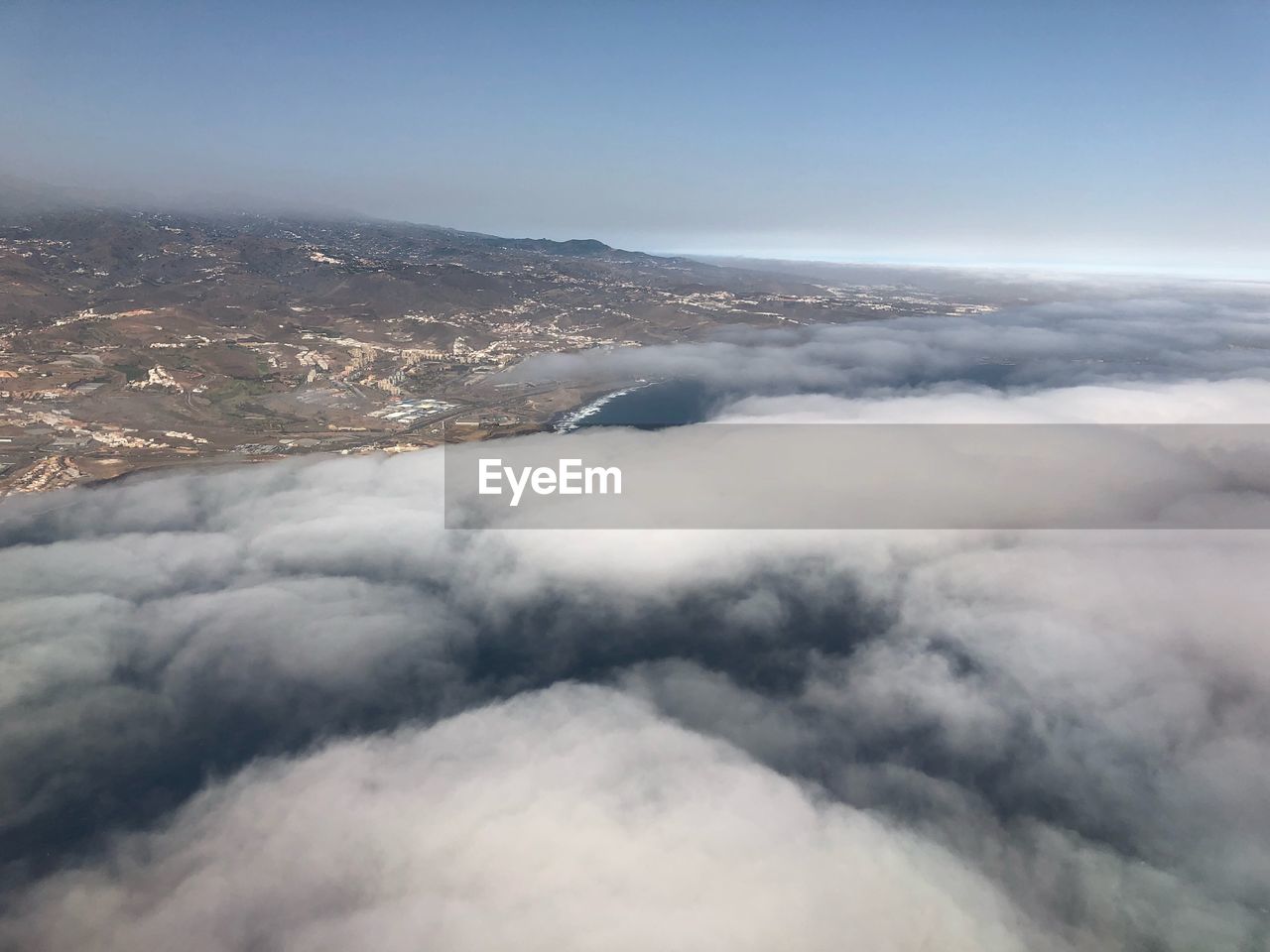 AERIAL VIEW OF CLOUDSCAPE OVER MOUNTAIN