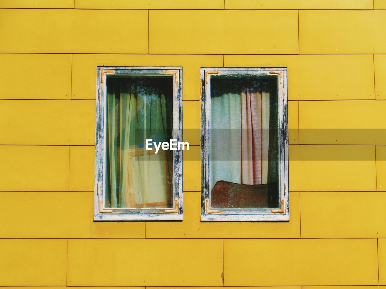 Full frame shot of yellow window of building