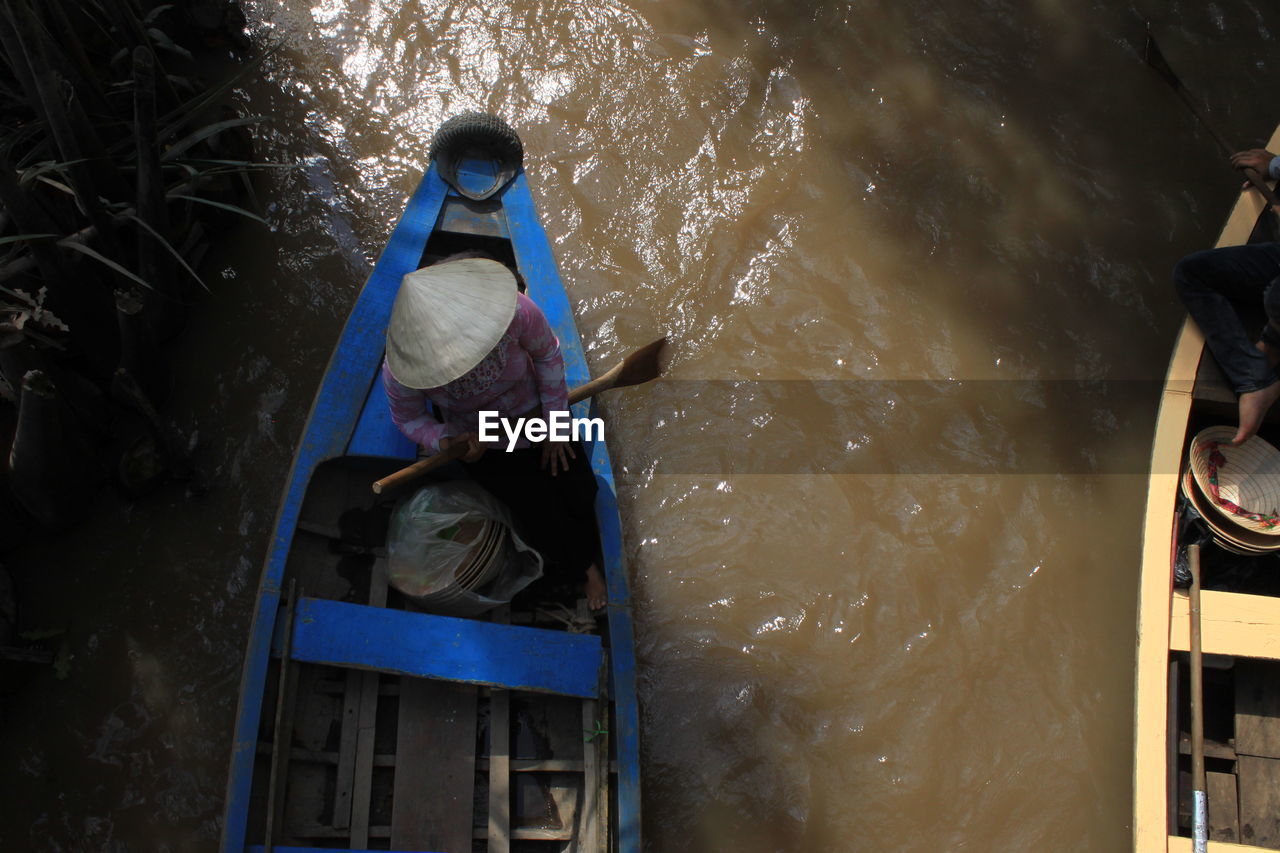 View of man sitting in boat