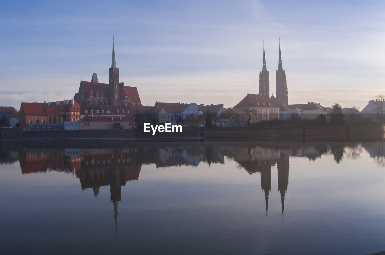 REFLECTION OF BUILDINGS IN WATER