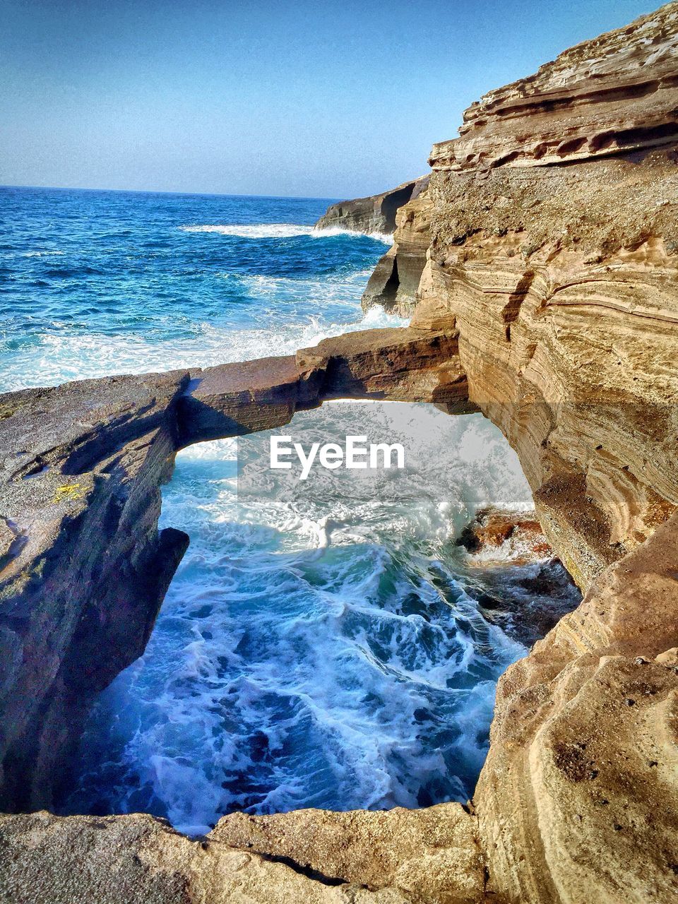 CLOSE-UP OF WAVES SPLASHING ON SHORE