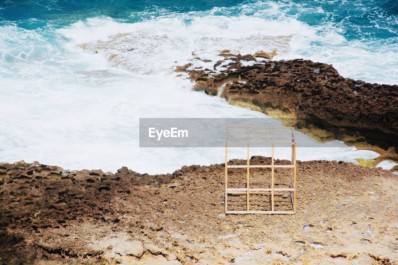 Wooden structure on shore at sea