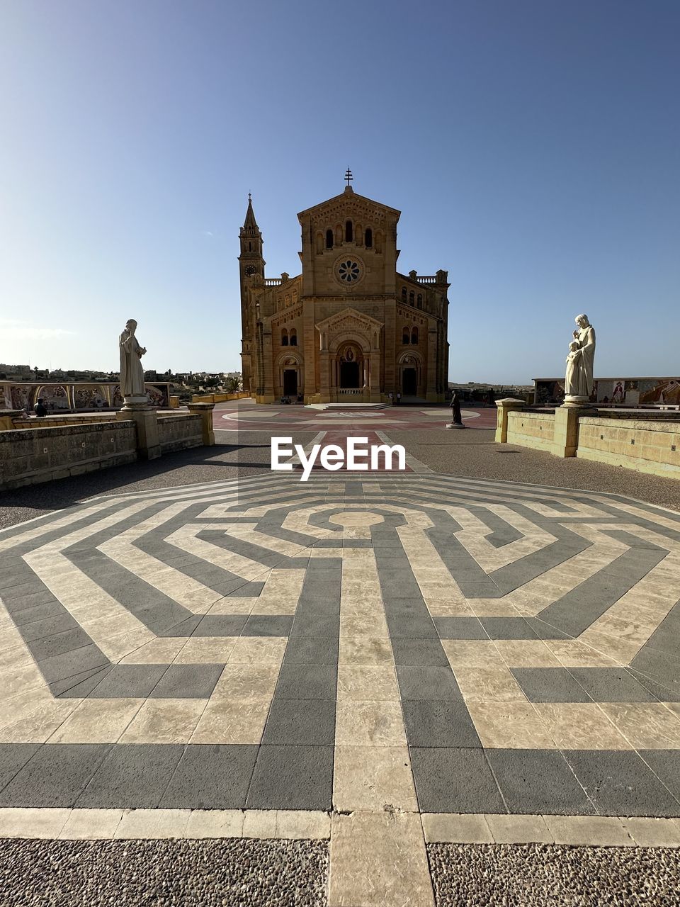 architecture, built structure, building exterior, building, sky, city, tower, travel destinations, nature, clear sky, wall, history, the past, no people, low angle view, skyscraper, day, religion, urban area, outdoors, landmark, travel, sunny, facade, place of worship, belief, sunlight, blue, tourism