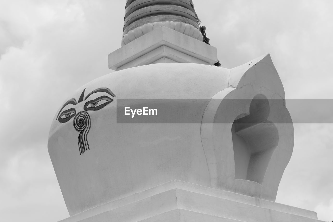 Low angle view of stupa against sky