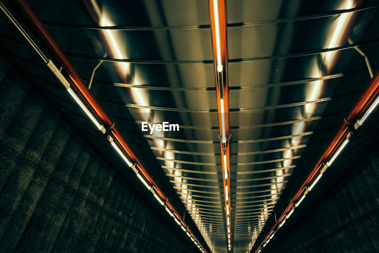 Low angle view of illuminated ceiling at subway station