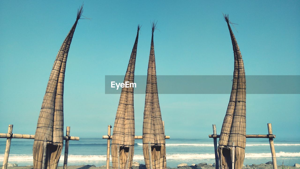 SAILBOAT BY SEA AGAINST CLEAR SKY