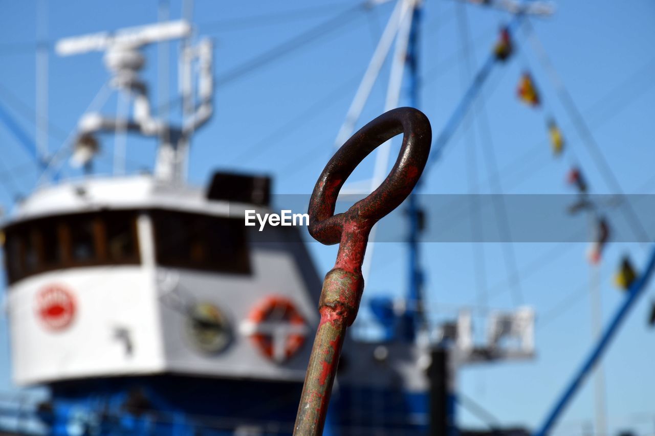 Close-up of metallic handle against ship