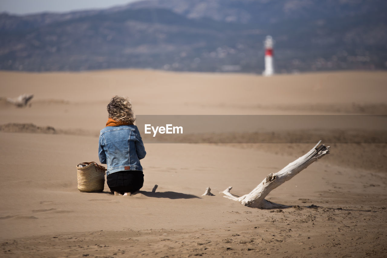 Rear view of woman on beach