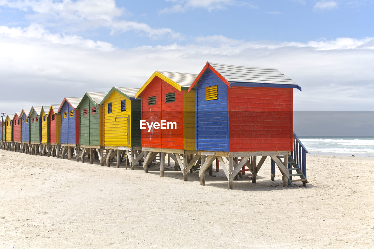 View of colorful beach huts on sandy beach