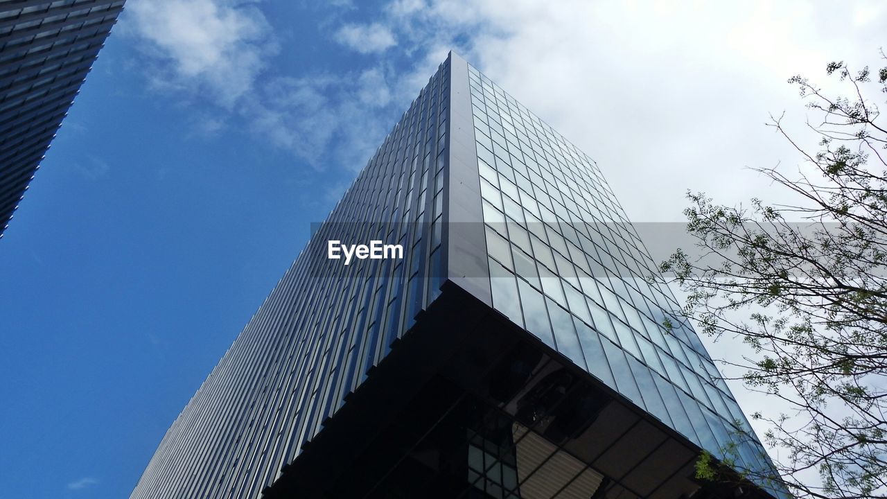 Low angle view of office building against sky