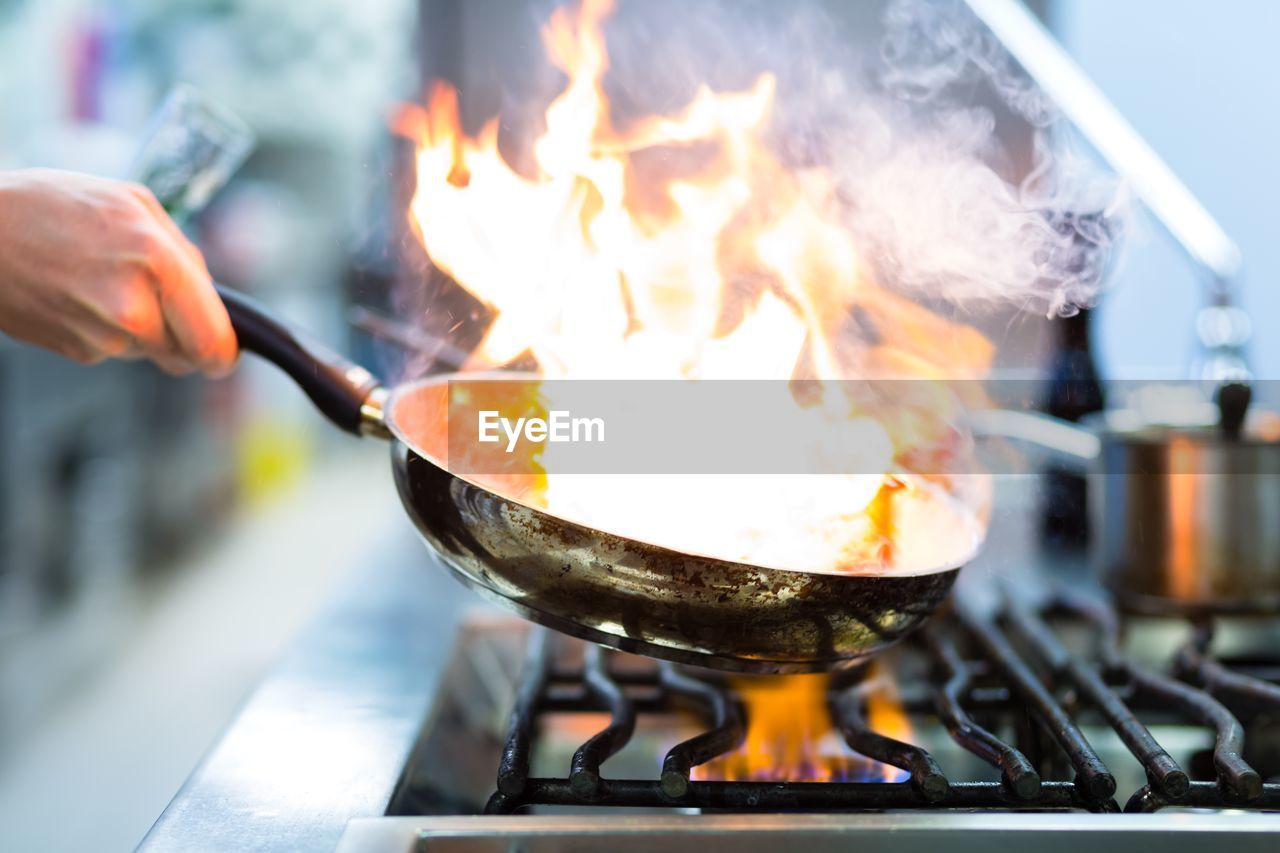 Midsection of man preparing food