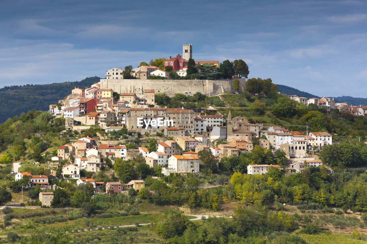 View of townscape against blue sky