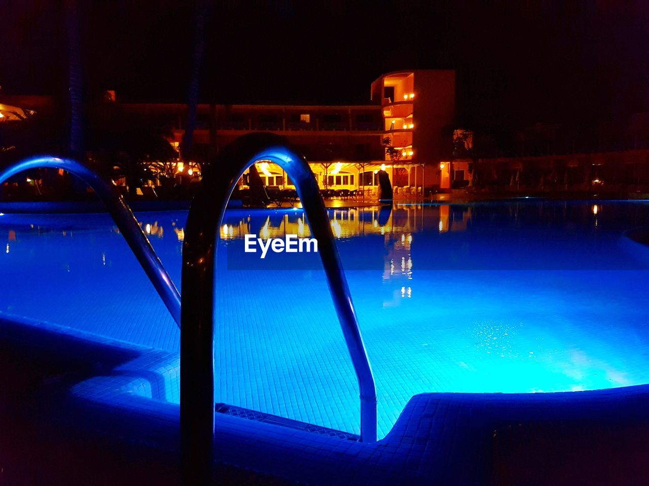 SWIMMING POOL BY RIVER AGAINST SKY