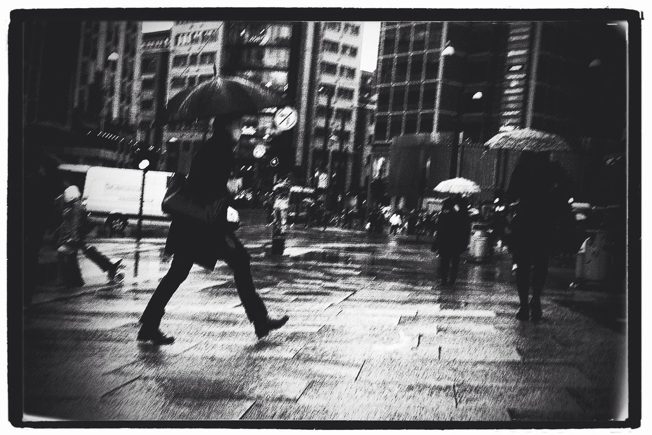 WOMAN WALKING ON CITY STREET