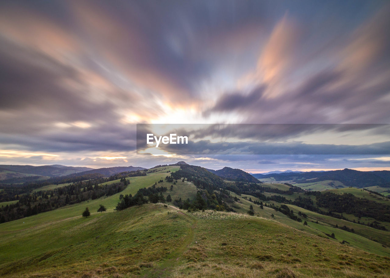 Scenic view of mountains against sky during sunset