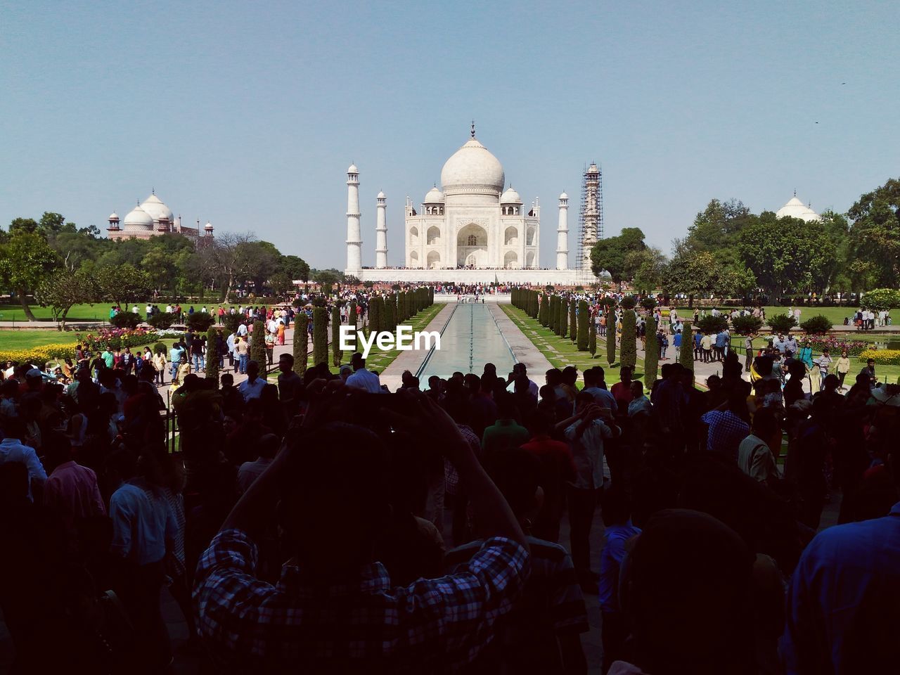 GROUP OF PEOPLE IN FRONT OF TEMPLE