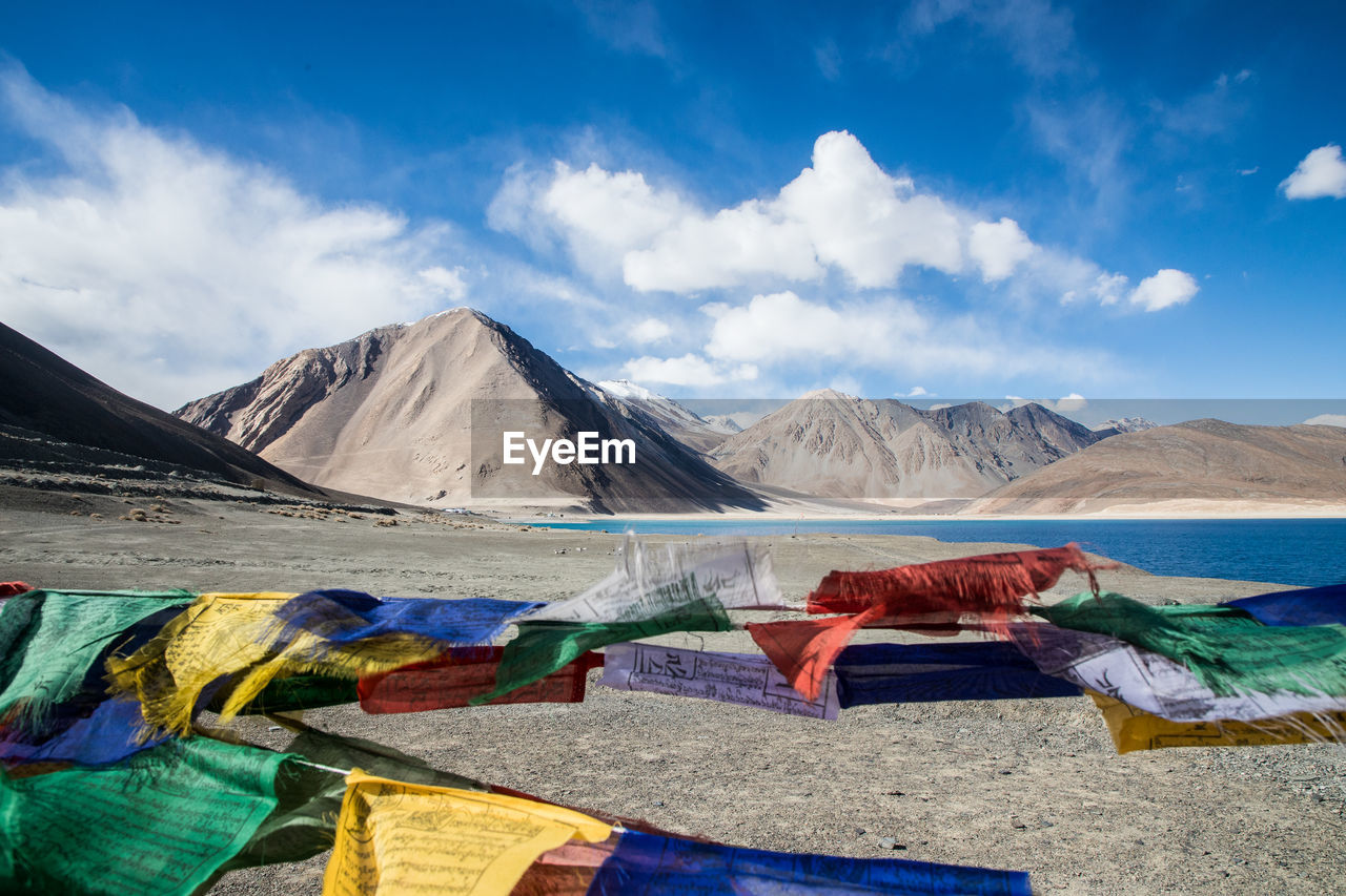 SCENIC VIEW OF MULTI COLORED MOUNTAINS AGAINST SKY