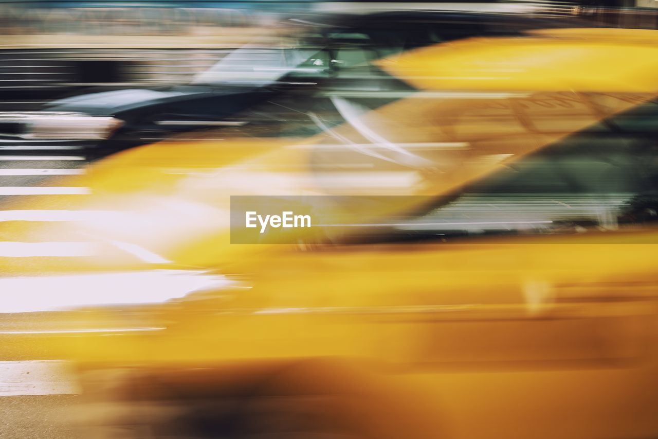 Blurred motion of yellow car 