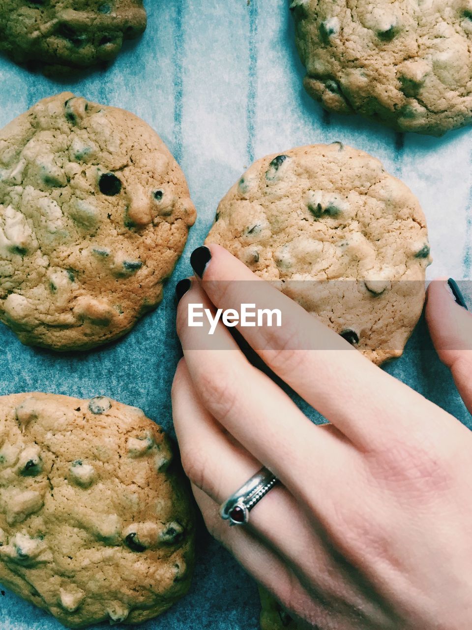 Close-up of woman hand holding cookies