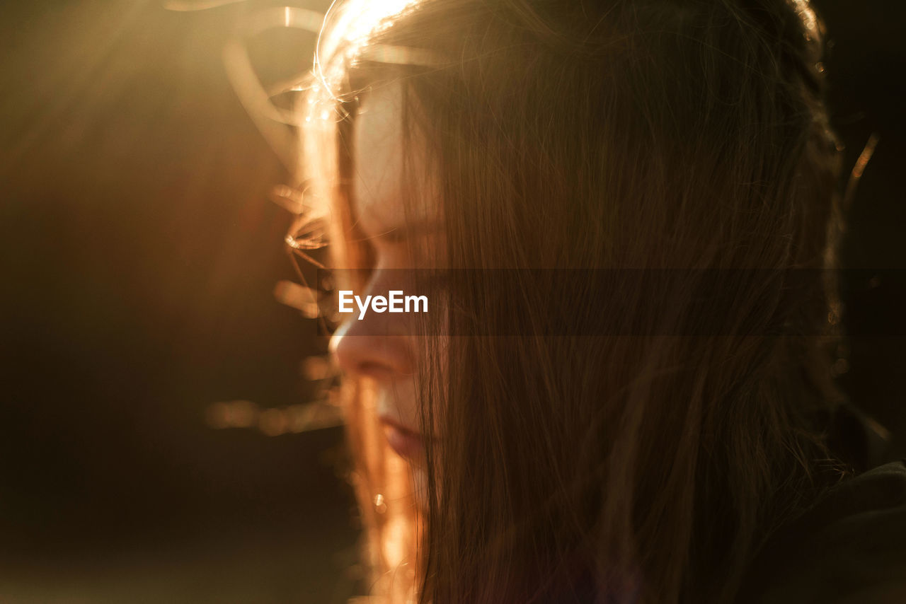 Beautiful portrait of a young stylish woman on a sunny day in autumn