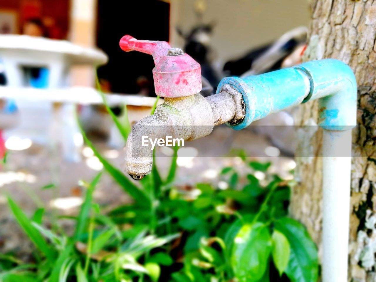 CLOSE-UP OF WATER DROP OF PIPE