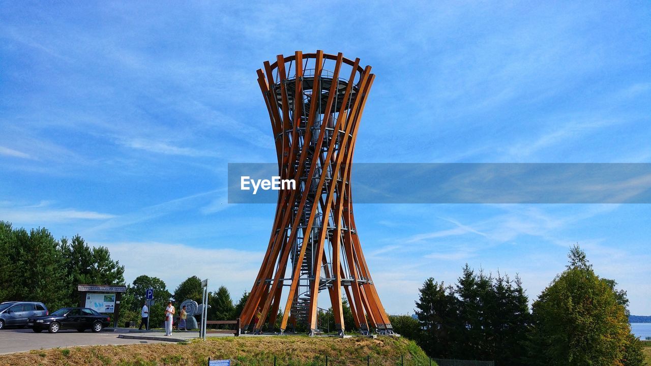 LOW ANGLE VIEW OF AMUSEMENT PARK RIDE AGAINST SKY