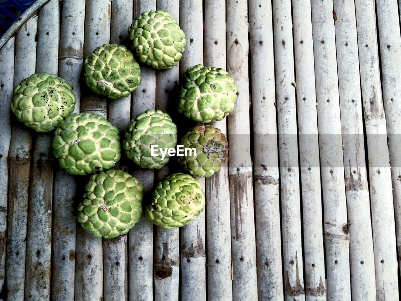 Directly above shot of custard apples on wooden table