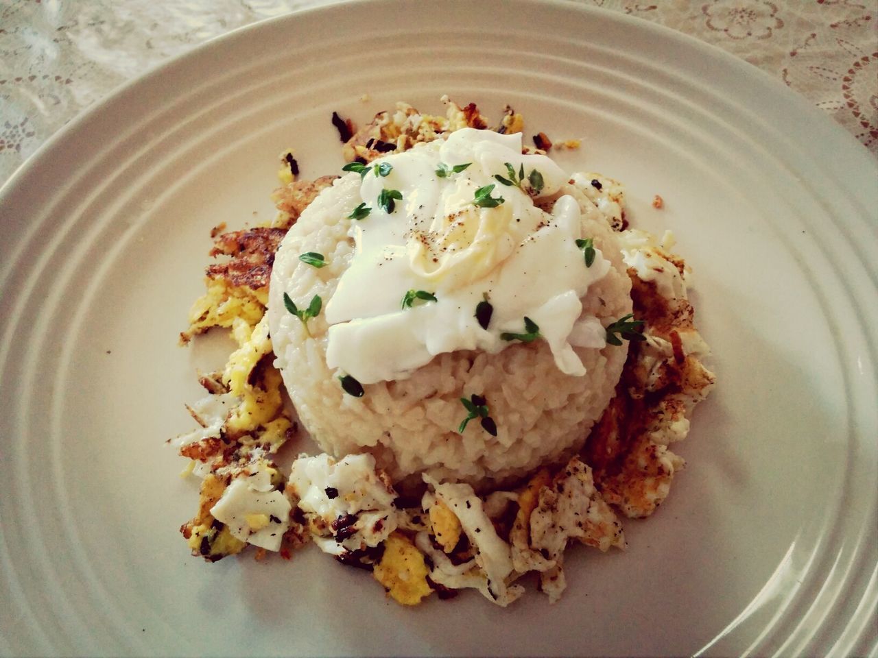 High angle view of risotto with scrambled egg served in plate