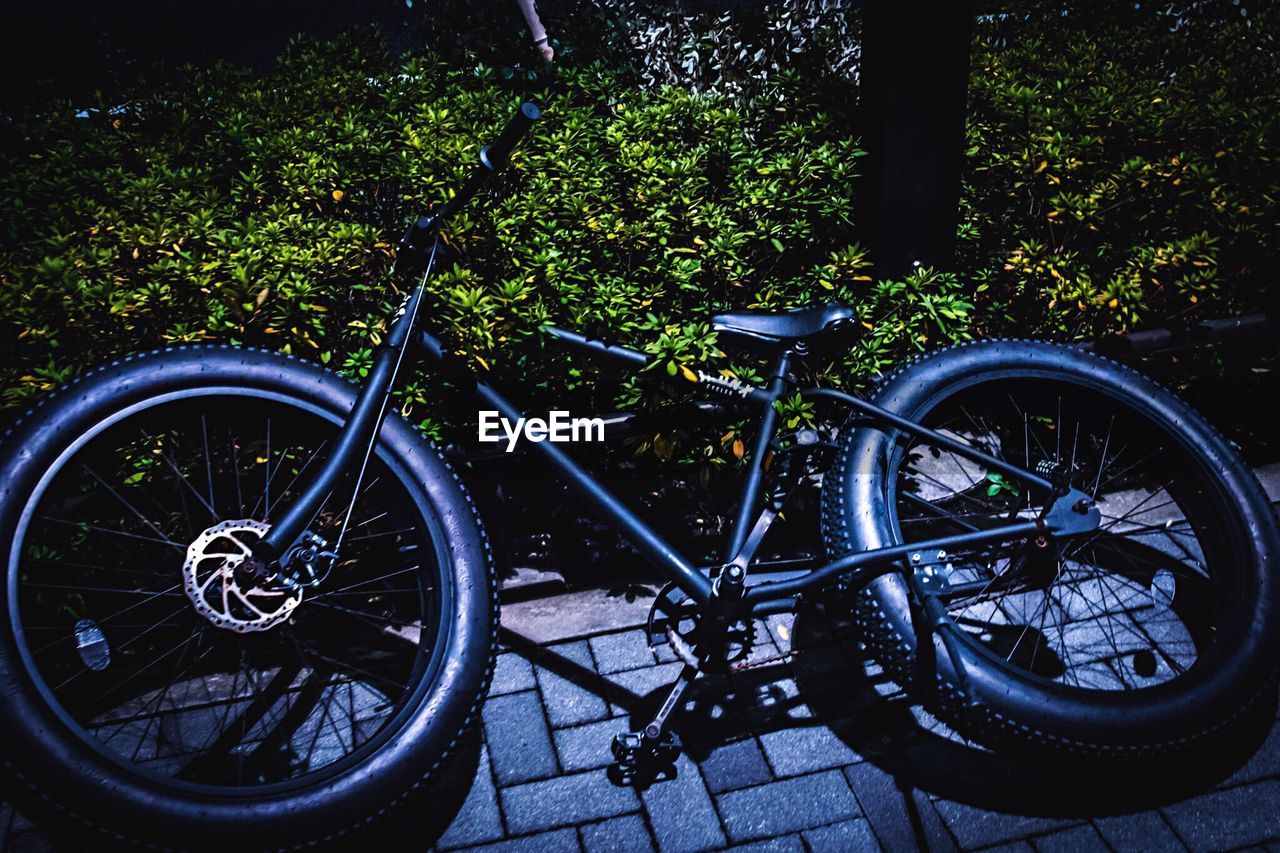 BICYCLES PARKED ON BICYCLE