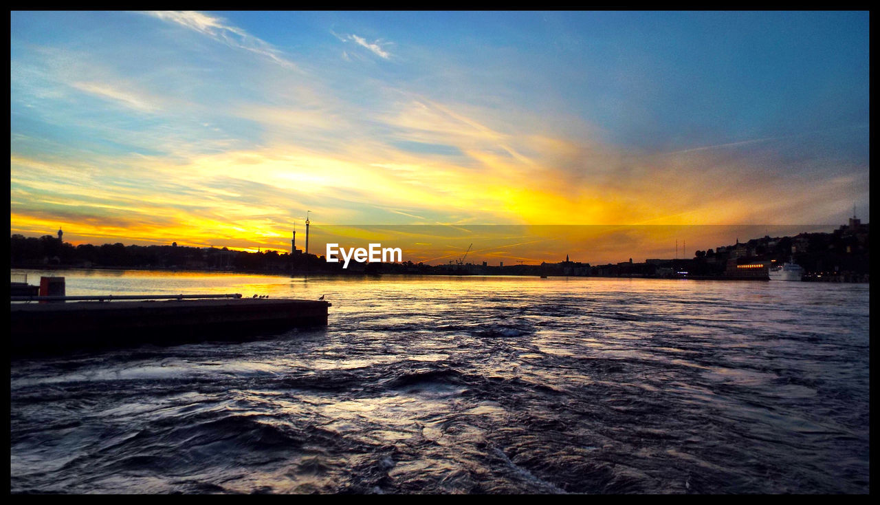 Scenic view of lake during sunset