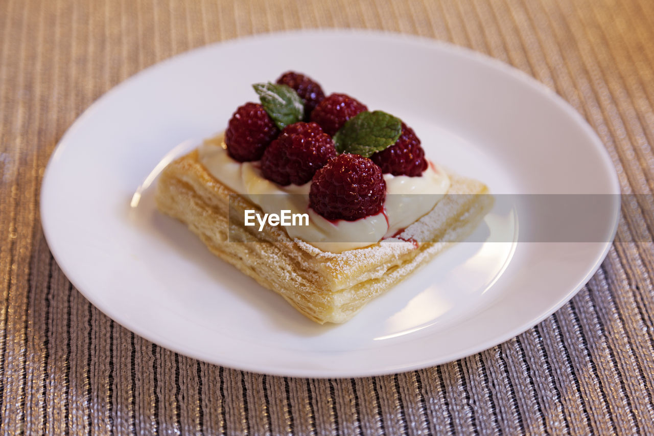 Luxurious dessert with raspberries for new years dinner