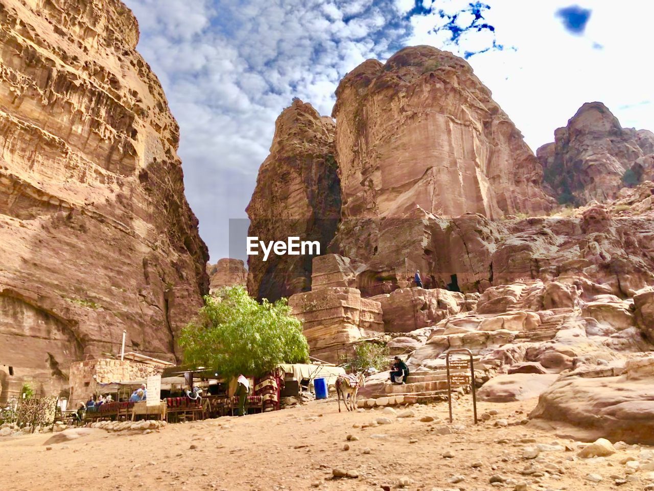TOURISTS ON ROCK FORMATION