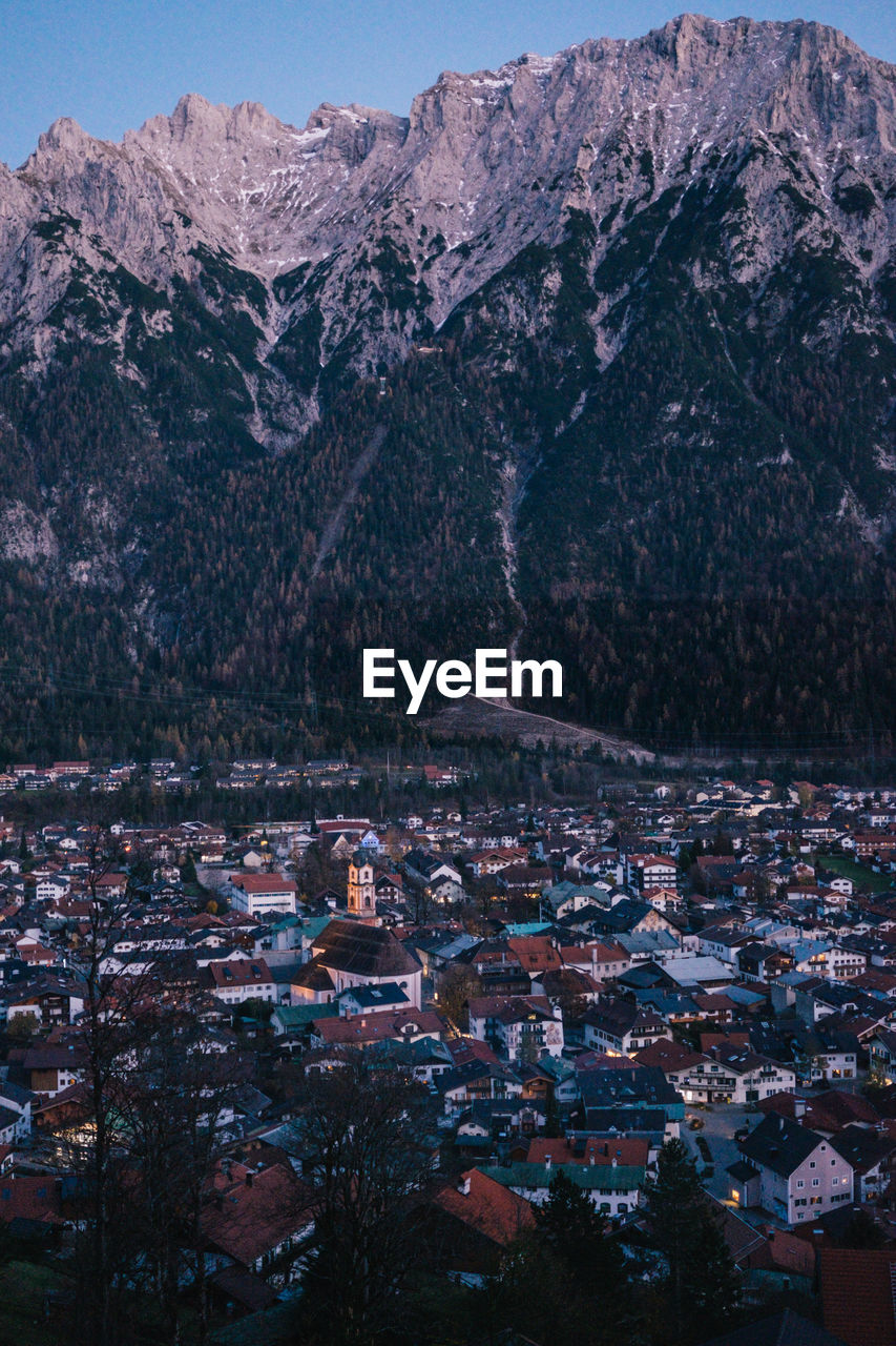 High angle view of townscape and mountains