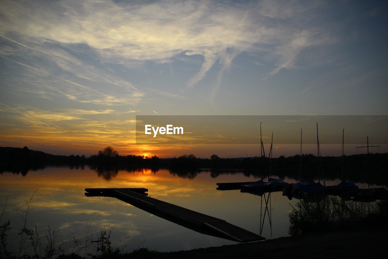 SCENIC VIEW OF SUNSET OVER LAKE